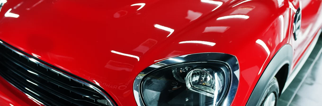 headlights and hood of sport red car in garage 2022 02 14 17 17 40 utc